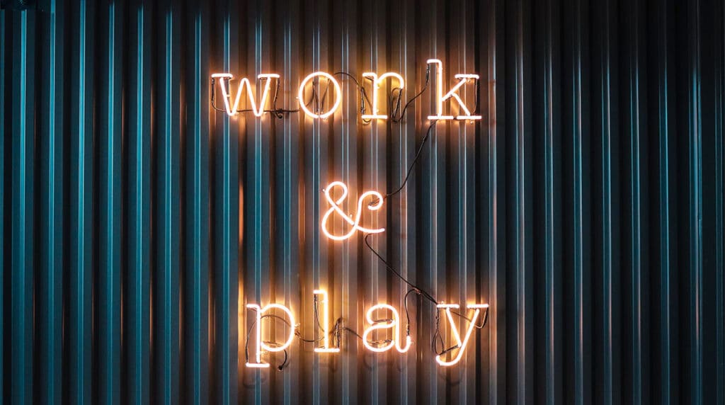 Work and Play yellow neon sign photo