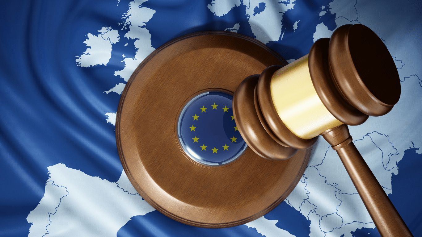 Image of a judge’s gavel placed over a map and the European Union flag, symbolising EU legislation on NIS2
